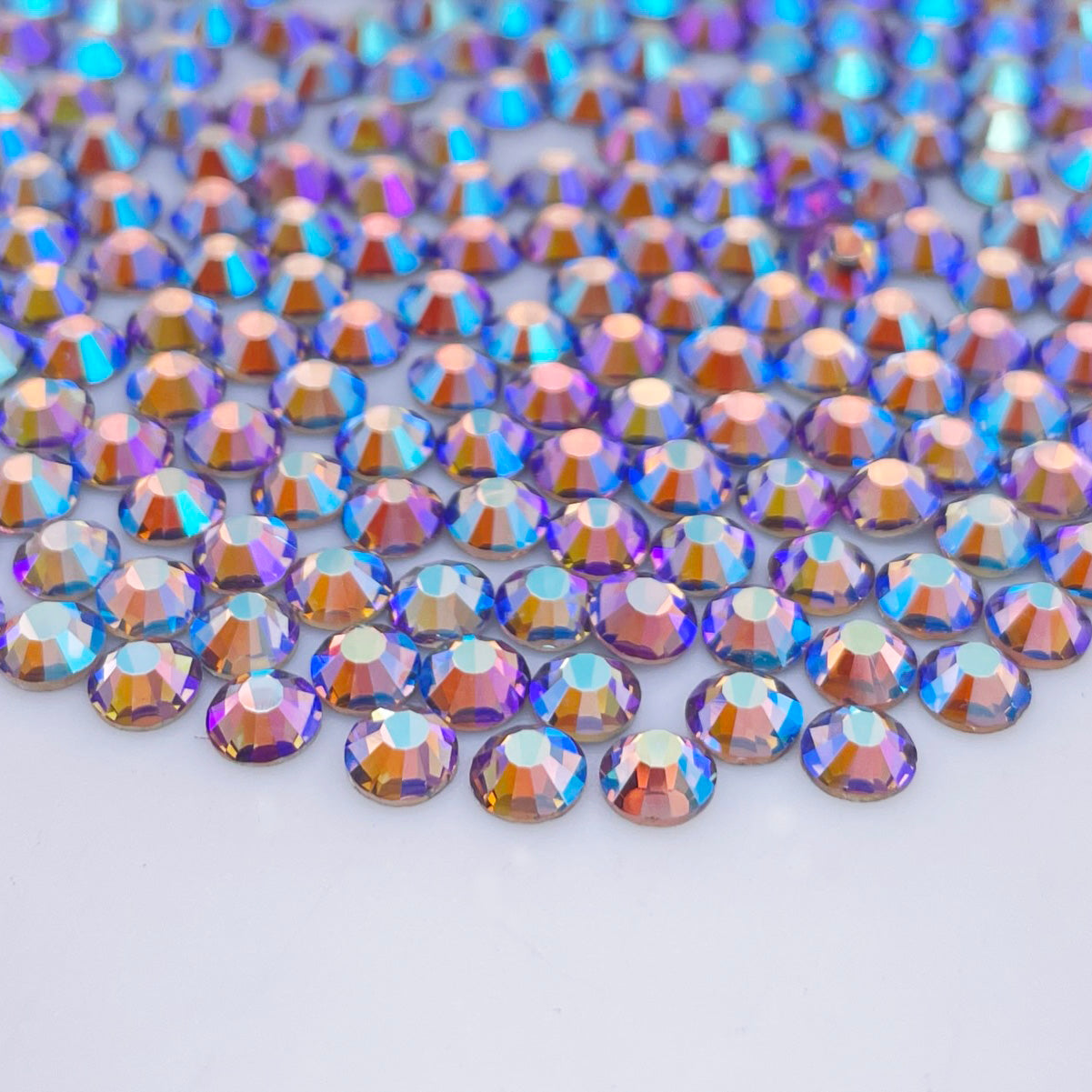 Light Amethyst AB rhinestones shown loose to show sparkle and cut
