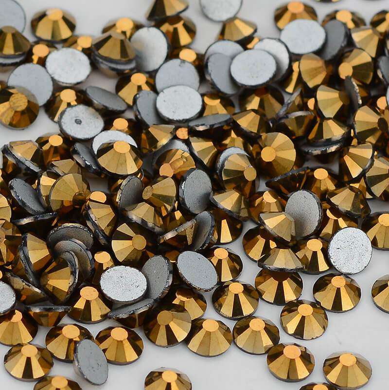 Mine Gold rhinestones shown loose to show sparkle and cut