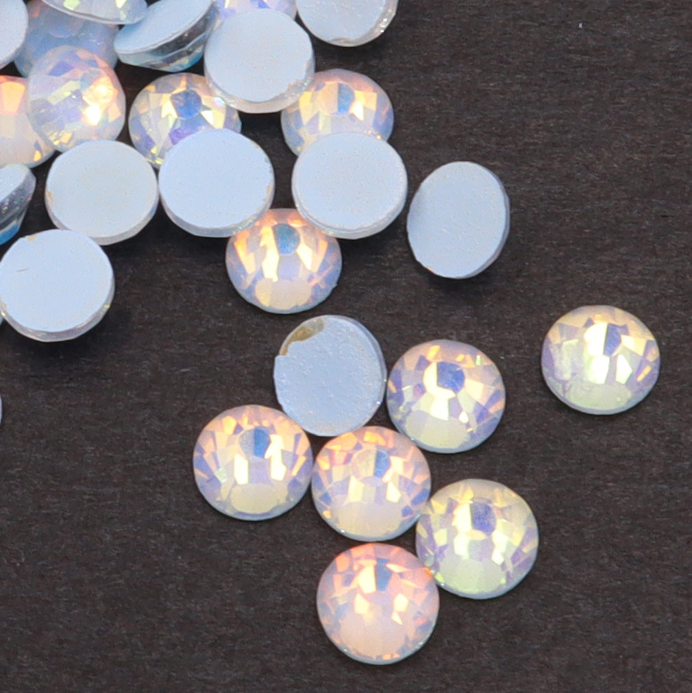 Light Sapphire Luminous Opal rhinestones shown loose to show sparkle and cut