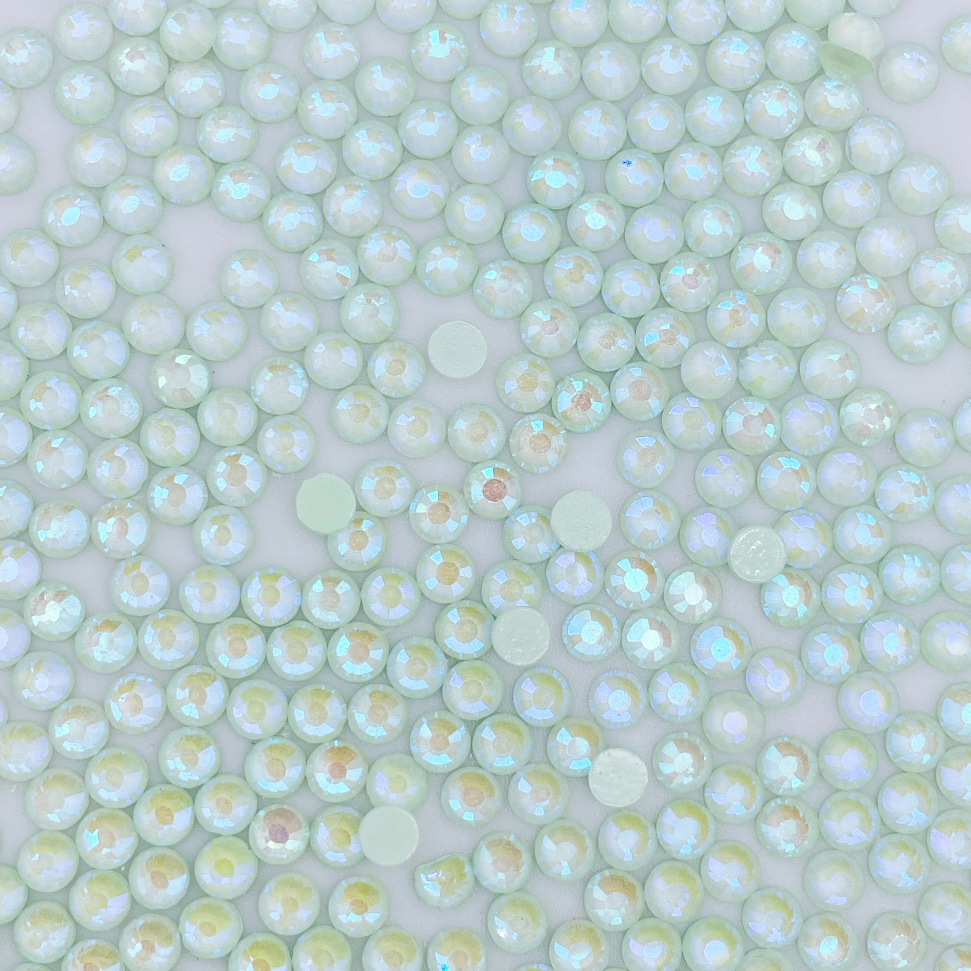 Light Peridot Luminous rhinestones shown loose to show sparkle and cut