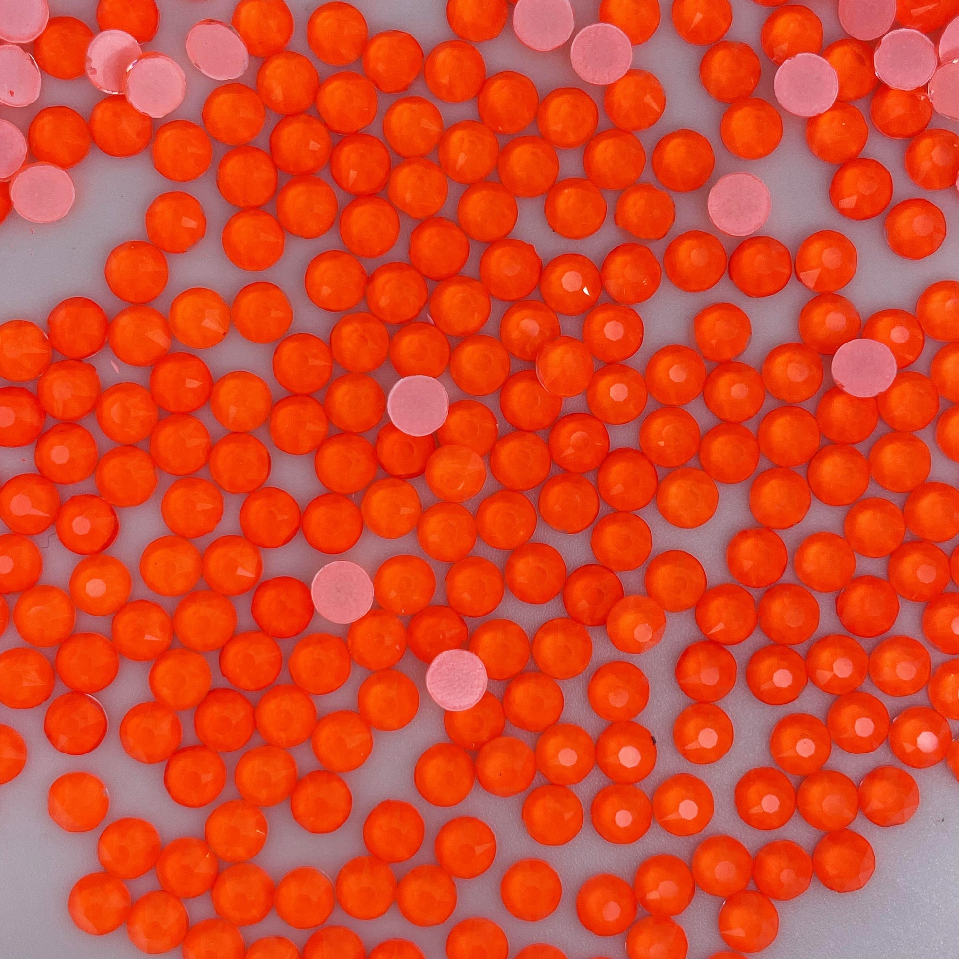 Hyacinth Neon rhinestones shown loose to show sparkle and cut