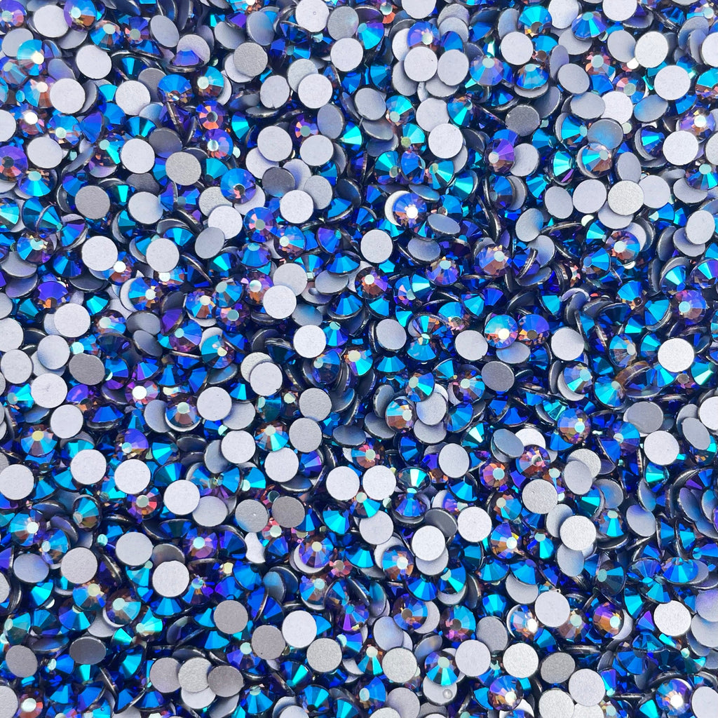 Tanzanite AB rhinestones shown loose to show sparkle and cut