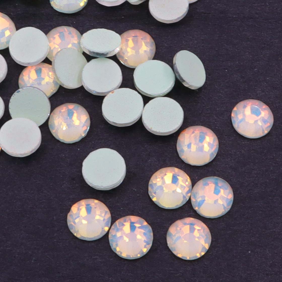 Light Peridot Luminous Opal rhinestones shown loose to show sparkle and cut