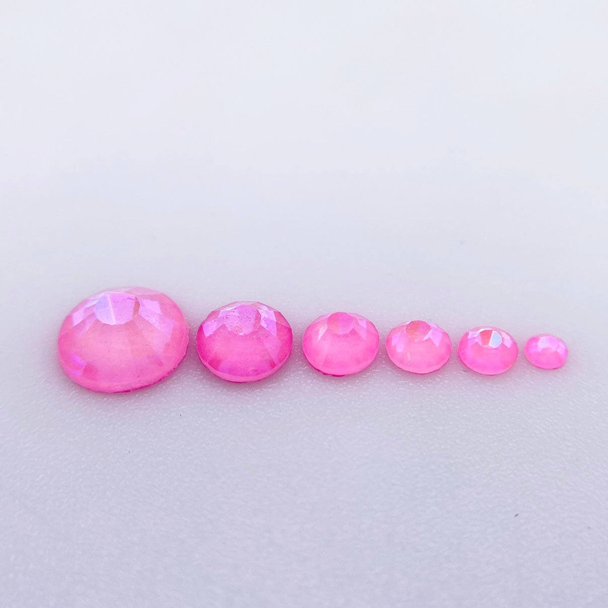Rose Luminous rhinestones shown loose to show sparkle and cut