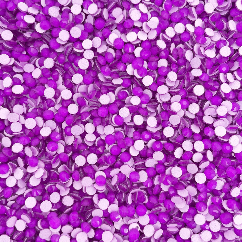 Dark Amethyst Neon rhinestones shown loose to show sparkle and cut
