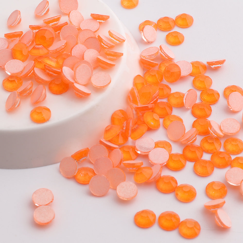 Orange Neon rhinestones shown loose to show sparkle and cut