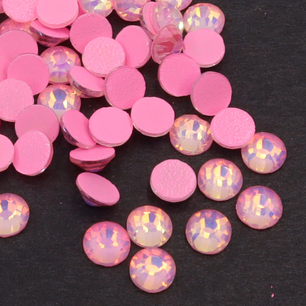 Light Pink Luminous Opal rhinestones shown loose to show sparkle and cut