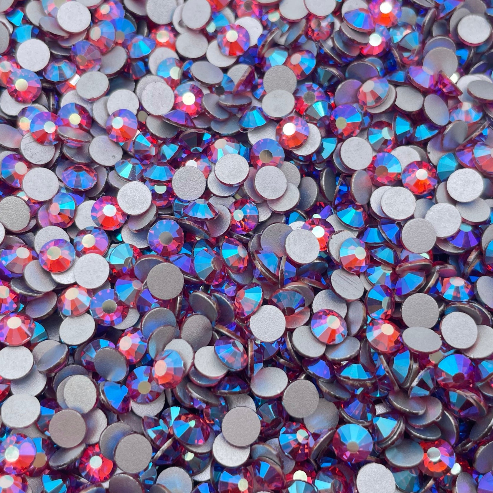 Rose AB rhinestones shown loose to show sparkle and cut