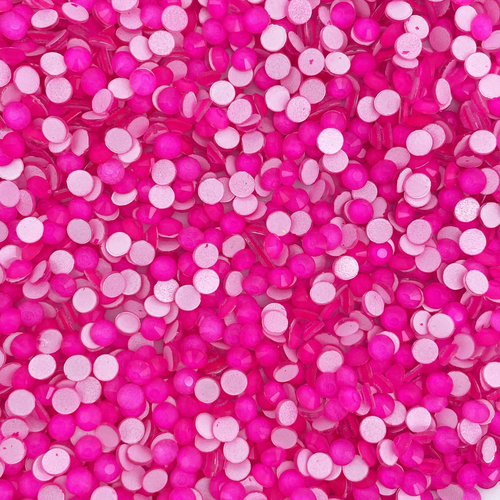 Rose Neon rhinestones shown loose to show sparkle and cut