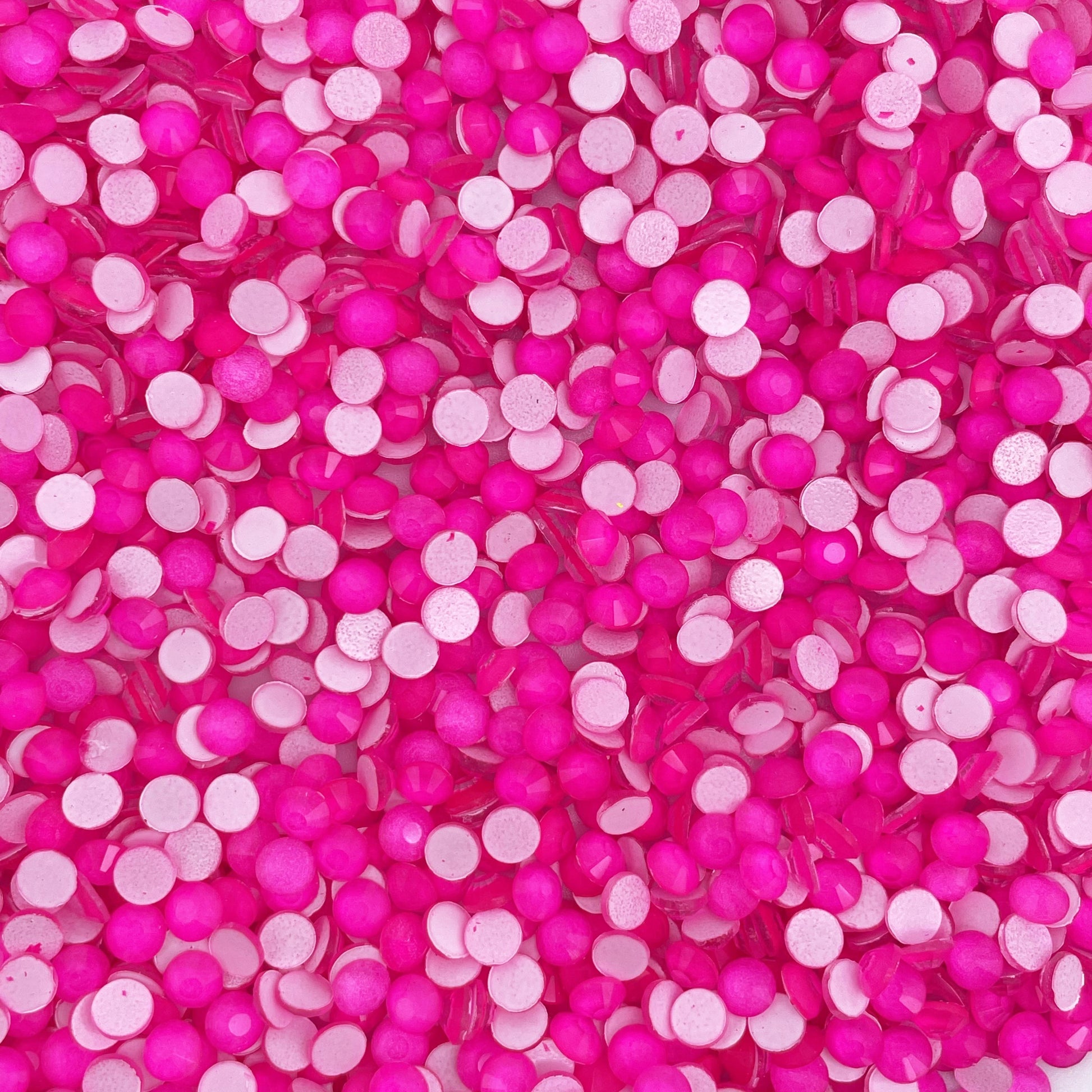 Rose Neon rhinestones shown loose to show sparkle and cut