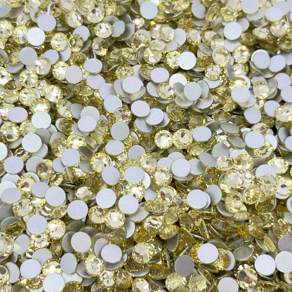 Jonquil rhinestones shown loose to show sparkle and cut