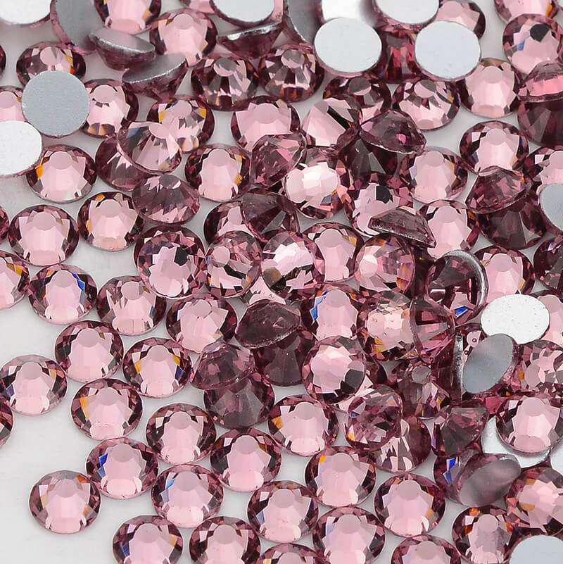 Light Amethyst rhinestones shown loose to show sparkle and cut